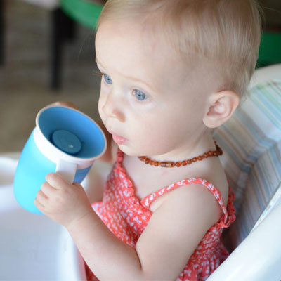 6 months photoshoot baby with mug 