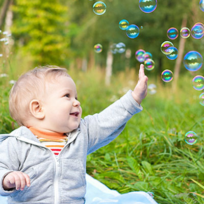 Baby is Playing with Bubbles 6 month baby girl photoshoot
