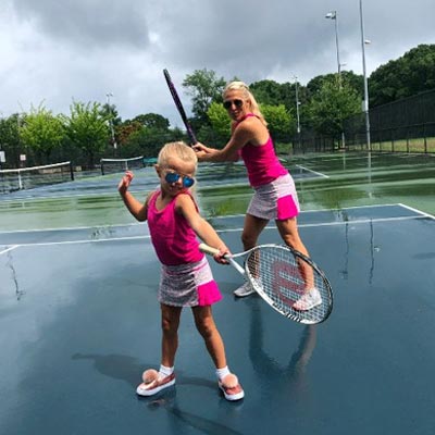 mother daughter photoshoot outfit ideas tennis rackets 
